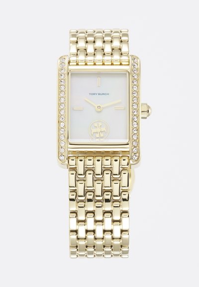 Goudkleurig rechthoekig horloge met kristallen accenten, witte wijzerplaat, minimale gouden markeringen en een metalen schakelen armband, merk Tory Burch.