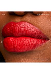 Full lips with vibrant matte red lipstick on dark skin, showing natural texture and no makeup retouching.