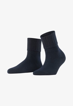 Chaussettes en coton bleu marine avec une finition côtelée et une texture lisse, de longueur courte au niveau de la cheville et dotées d'un renfort aux orteils et au talon pour plus de durabilité.