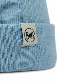 Blue knitted beanie hat with ribbed texture, featuring a white woven label with the brand name "Buff" in black lettering.