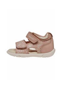 Rosa lædersandal med blomsterprint, dobbelte Velcro-remme, åben tå, polstret krave og gummisål designet til åndbarhed.