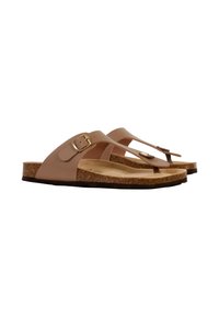 Sandales à semelle en liège marron avec deux straps, l'un comportant une boucle et l'autre un bouton décoratif. Matériau supérieur lisse, profil plat.