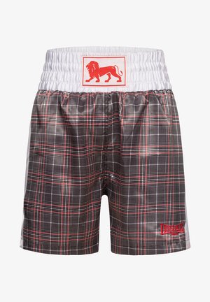 Plaid maudymosi šortai su plačiu elastingu juosmeniu, daugiausia juodi, su raudonomis detalėmis ir raudonu liūto logotipo ženklu priekyje.