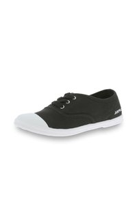 Black canvas shoe with white rubber toe cap, flat laces, and a textured sole. Features a subtle logo on the side.