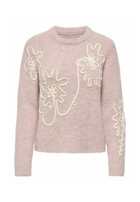 Lys rosa strikkegenser med rund hals, med hvite blomsterapplikasjoner og dekorative snøringer på forsiden og ermene.