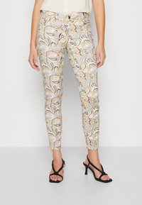 Kalhoty se vzorem na béžovém pozadí, s mnohobarevným paisley vzorem. Slim fit, délka do kotníků, se zapínáním na zip a knoflík.