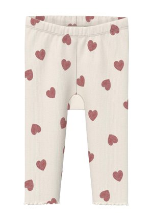Cream ribbed toddler leggings with scattered red heart patterns and a wavy hem at the bottom of each leg.