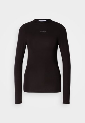 Svart langermet topp laget av elastisk stoff med rund hals og minimalistisk logodetalj på brystet. Jevn tekstur, tettsittende design.