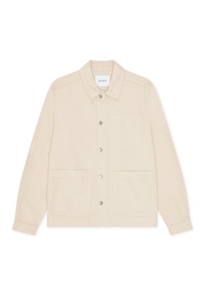 Φωτεινό μπεζ σακάκι κατασκευασμένο από υφασμάτινη ύφανση με υφή. Διαθέτει μυτερό γιακά, κλείσιμο με κουμπιά μπροστά και δύο μεγάλες μπροστινές τσέπες.