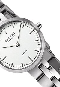 Montre en acier inoxydable argenté avec un cadran blanc, des aiguilles des heures et des minutes fines, et des marqueurs d'heure minimalistes. Elle est dotée d'un bracelet en maillons poli.