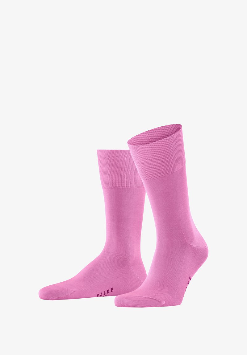 Calzini al ginocchio rosa chiaro realizzati in materiale liscio e elasticizzato, con risvolti a coste e design della punta senza cuciture. Presentano un piccolo logo "FALKE" sulla suola.