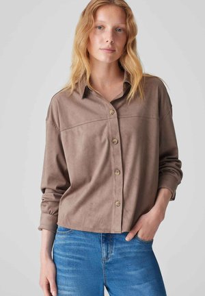 Brown, soft fabric button-up shirt with a relaxed fit, featuring a collar, long sleeves, and front button closure. Pairing with blue jeans.