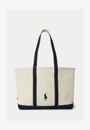 Smėlio spalvos ir tamsiai mėlynos drobinė rankinė su dviem rankenomis, kontrastine tamsiai mėlyna apdaila ir mažu siuvinėtu polo žaidėjo logotipu priekyje.
