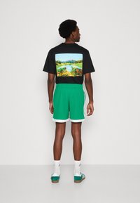 adidas Originals MOCK EYELET - Träningsbyxor - green