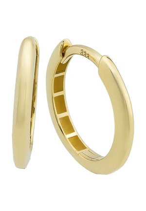 Boucles d'oreilles en or en forme de créoles, avec une surface lisse et polie et une forme tubulaire. Elles possèdent un système de fermeture à charnière et un intérieur avec un motif en grille.