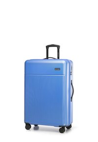 Hard-shell blue suitcase with vertical ribbed texture, retractable black handle, and smooth rolling wheels. Features a brand logo.