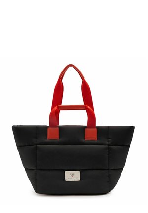 Sac cabas noir matelassé avec des poignées rouges et une étiquette blanche portant l'inscription "UNIO X VISIONNAIRES" au centre avant.