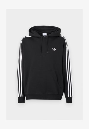 Melna kapuces kreklā izgatavots no kokvilnas, ar priekšējo kabatu, baltu trīsrindu dizainu uz piedurknēm un mazu balto logotipu uz krūts.