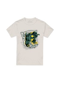 White cotton T-shirt featuring a graphic design of a green and yellow dinosaur character against a stylized background with graffiti accents.