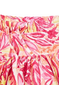 Tessuto floreale nei toni di rosa, arancione e giallo. Presenta una vita arricciata con cordoncino. Materiale di cotone leggero e testurizzato.
