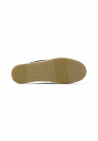 Rubber shoe sole with a textured, beige surface and black upper edge. The sole features a pattern of small raised dots for traction.