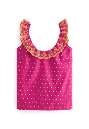 Haut rose sans manches avec petit motif de points jaunes et large encolure à volants brodée de motifs floraux jaunes complexes.