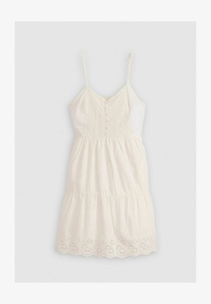 Witte katoenen jurk met een aansluitend lijfje, verstelbare spaghetti-bandjes, geborduurde details en een uitlopend, gelaagd rokje met een golvende zoom.