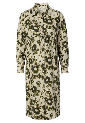 Bloemen shirtjurk in crème en groen, met lange mouwen, een knoopsluiting aan de voorkant en een aansluitende taille met een strikdetail. Zachte katoenen stof.