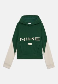 Grønn hettegenser med beige lange ermer, frontlomme, stort "NIKE" logo og liten Nike swoosh. Myk tekstur og avslappet passform design.