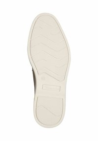 White rubber sole with zigzag pattern and textured surface. Features branding in the center and size marking (42) on the side.