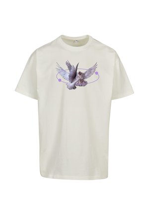Maglietta di cotone color crema con una grafica di un uccello in volo, caratterizzata da accenti color lavanda e un design circolare intorno.