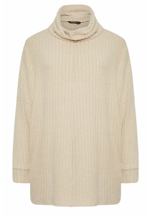 Jersey de cuello alto de canalé en color beige con corte holgado, mangas anchas y una textura suave. Presenta un escote alto para mayor calidez.