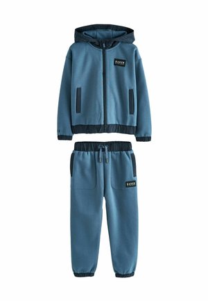 Blaues Sweatshirt- und Hosen-Set mit einer Reißverschluss-Hoodie, Seitentaschen, elastischen Bündchen und einem Logopatch auf der Brust und an den Hosen. Weiches Material.