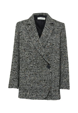 Blazer v vzorju houndstooth v črni, beli in rjavi barvi. Ima dvojno zapenjanje, široke reverje in sprednje žepe. Gladka tekstura.