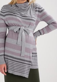Striped maternity sweater in light purple and gray, featuring a cowl neck, long sleeves, and a tied waist for a fitted look.