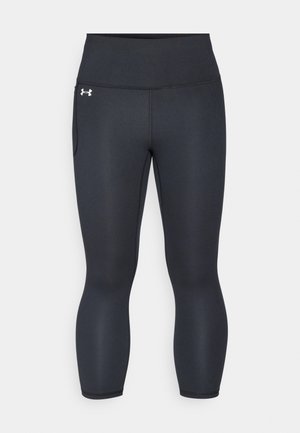 Zwarte sportleggings van elastisch materiaal, met een hoge tailleband en zijzak, een gladde textuur en een slim fit ontwerp.