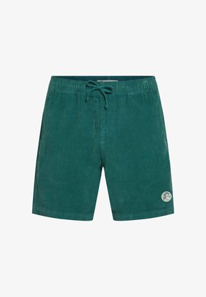 Green corduroy swim shorts with an elastic waistband, drawstring, and a circular brand patch on the lower right side.