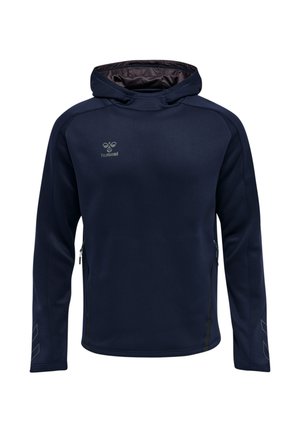 Marineblå hættetrøje med lange ærmer, foran lynlåse i siderne, subtile reflekterende Chevron-mønstre på ærmerne og lille hummel-logo på brystet.