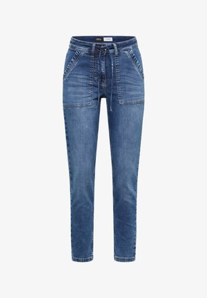 Blaue Denim Slim-Fit-Hose mit Kordelzugbund und großen aufgesetzten Fronttaschen, beschriftet mit "Cecil Denim" am inneren Taillenbund.