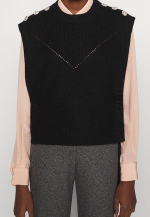 Gilet sans manches en tricot noir avec un design texturé, ornements aux épaules et une découpe en forme de V à l'avant.