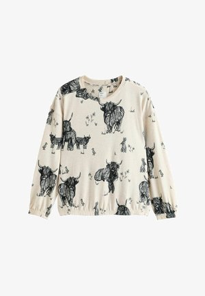 Bluza crem cu ilustrații negre cu bovine din munți și animale mici, cu manșete și tiv elasticizate. Material moale din bumbac.