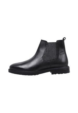 Botín Chelsea de cuero negro hasta el tobillo con panel elástico lateral y lengüeta de tirador, con tacón bajo y puntera redondeada.
