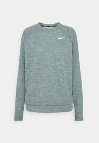Helles Türkis langärmliges Sport-Sweatshirt aus strukturiertem Stoff, mit Raglanärmeln und einem weißen Nike-Logo auf der Brust.