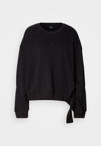 Sweat-shirt noir à manches longues avec col rond, petit logo sur la poitrine et détail noué en tissu sur le côté de l’ourlet.