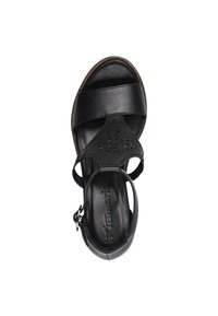 Sandal in pelle nera con punta aperta e design a taglio. Caratterizzato da un upper snodato con due ampie cinghie e una fibbia alla caviglia.
