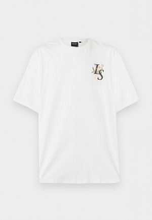 T-shirt blanc à manches courtes avec petites initiales "LS" décorées de fleurs et de feuilles sur le côté gauche de la poitrine.