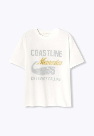 T-shirt en coton blanc avec un graphique "COASTLINE Memories" en argent et or, col rond, manches courtes et coupe décontractée.