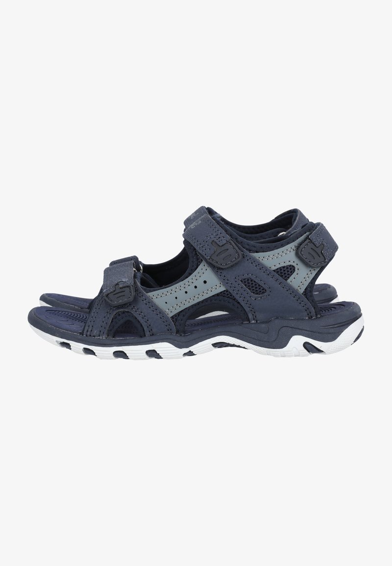 Navy blue sandals featuring adjustable Velcro straps, mesh panels, and a textured white sole for grip. Lightweight design with open toe and heel.