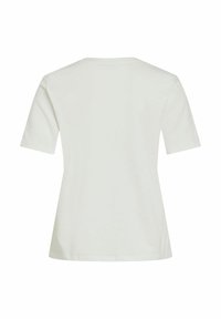 Biała bawełniana koszulka z luźnym krojem, krótkimi rękawami i okrągłym dekoltem. Tył jest gładki, bez dodatkowych ozdób czy wzorów.