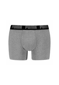 Bañadores gris de algodón suave, con una cinturilla elástica negra que lleva el logo "PUMA" en gris. Textura suave y diseño ajustado.